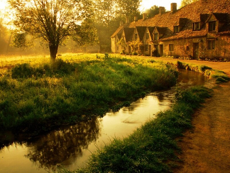 village by the river at sunrise