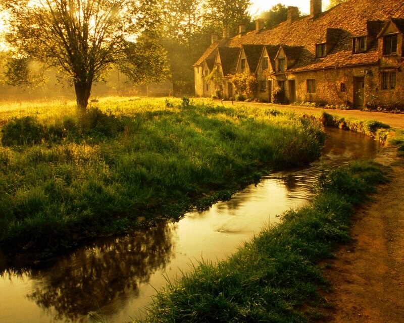 Village by the river at sunrise