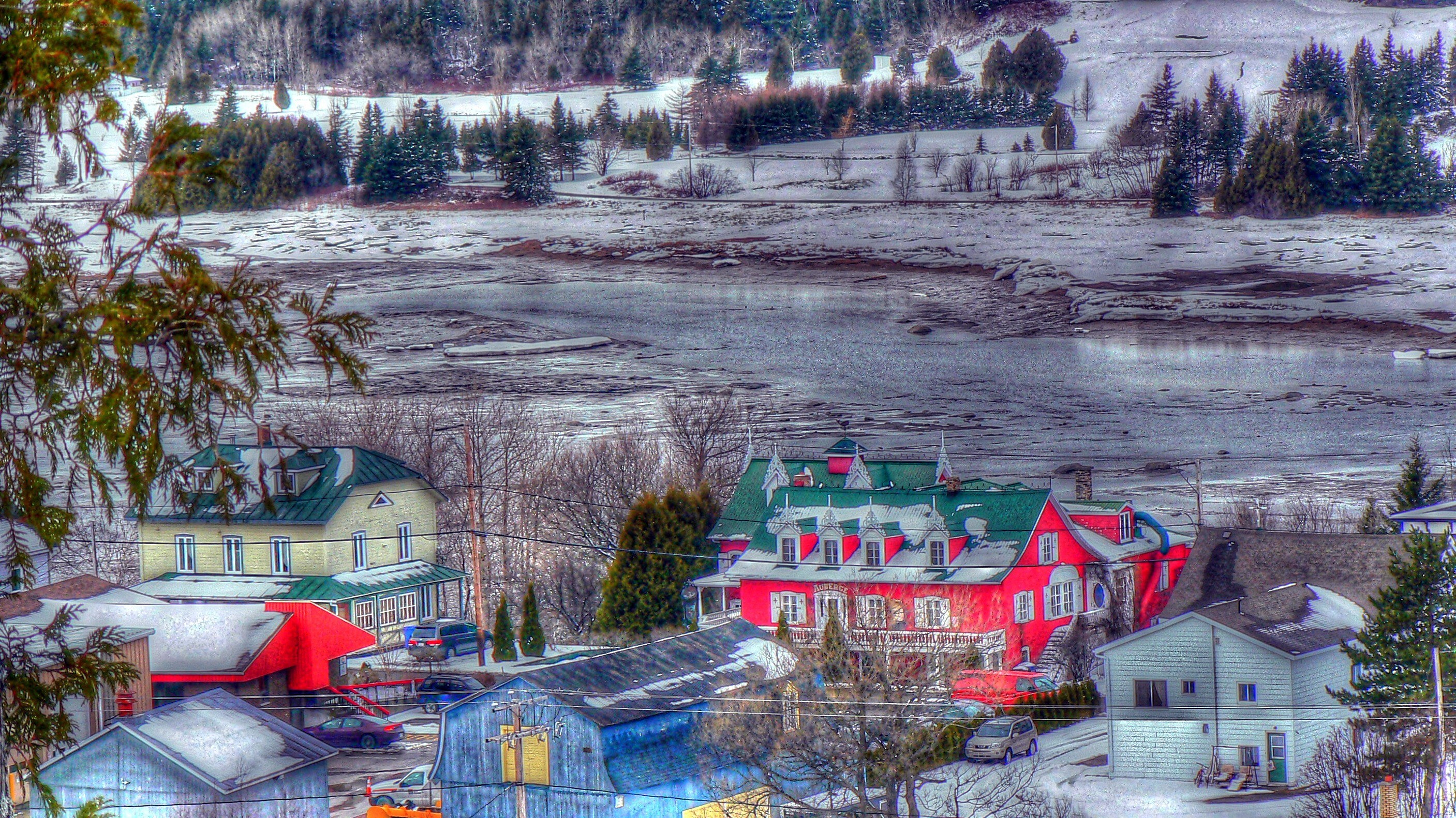 Village by the river in winter
