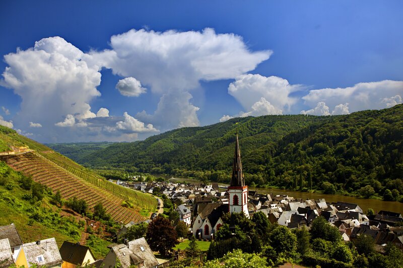 Village by the river with church