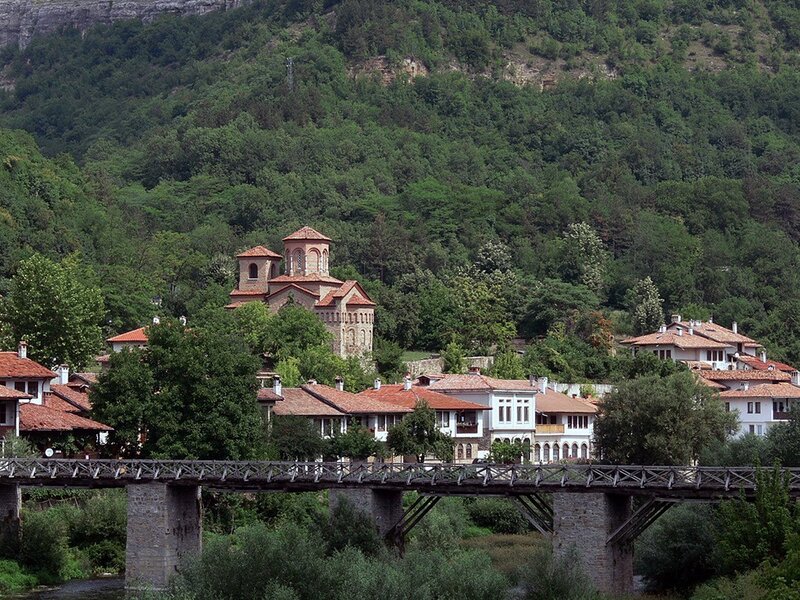 Village by the river with old bridge