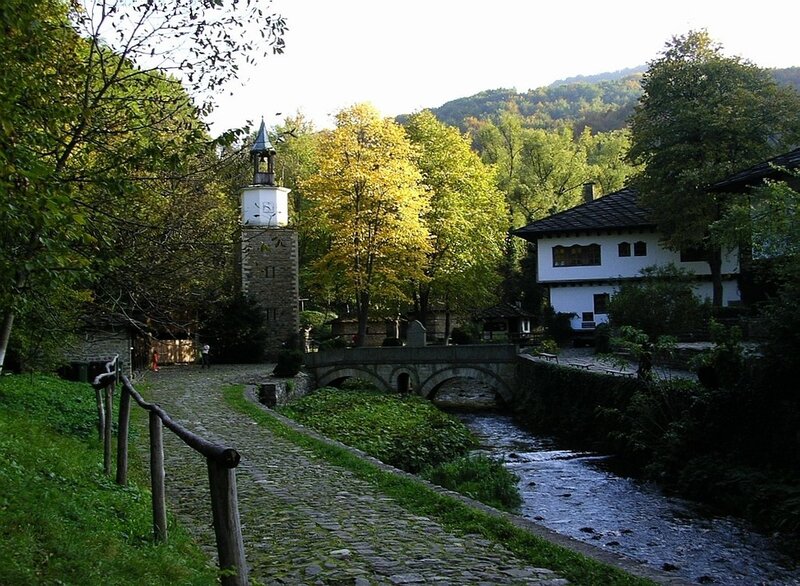Village by the river with stone bridge