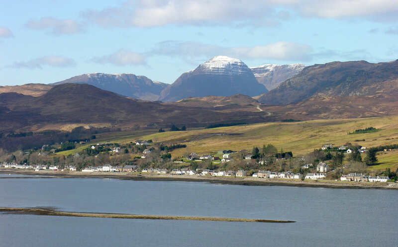 village by the sea with mountains