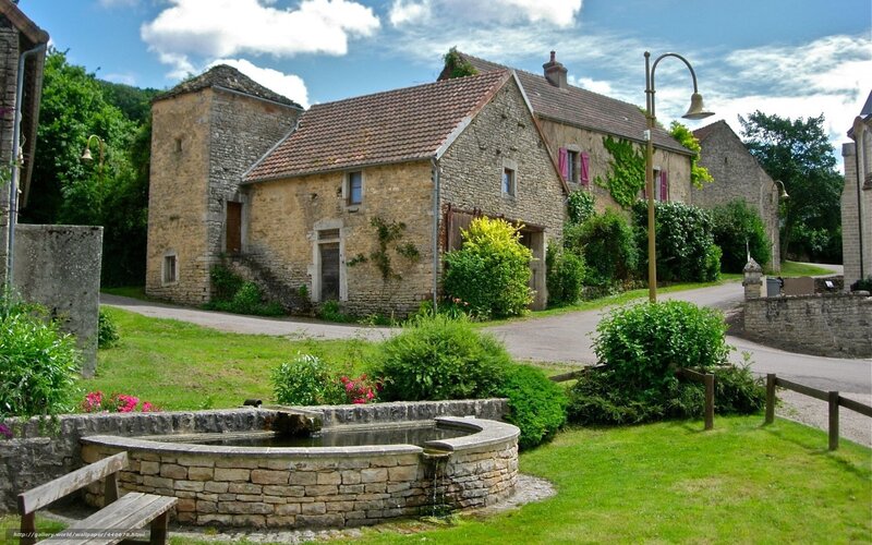 village fountain and stone houses