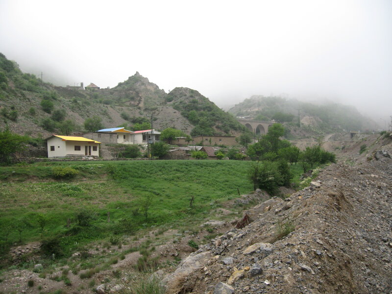 village in a misty mountain valley