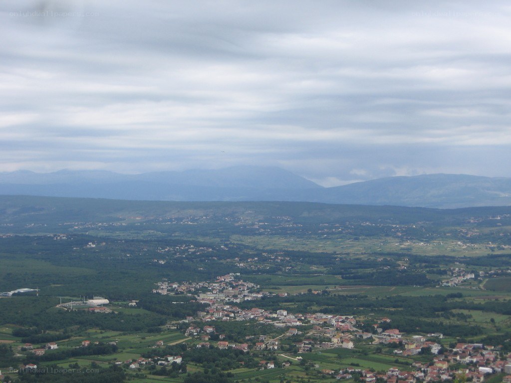village in a valley with mountains