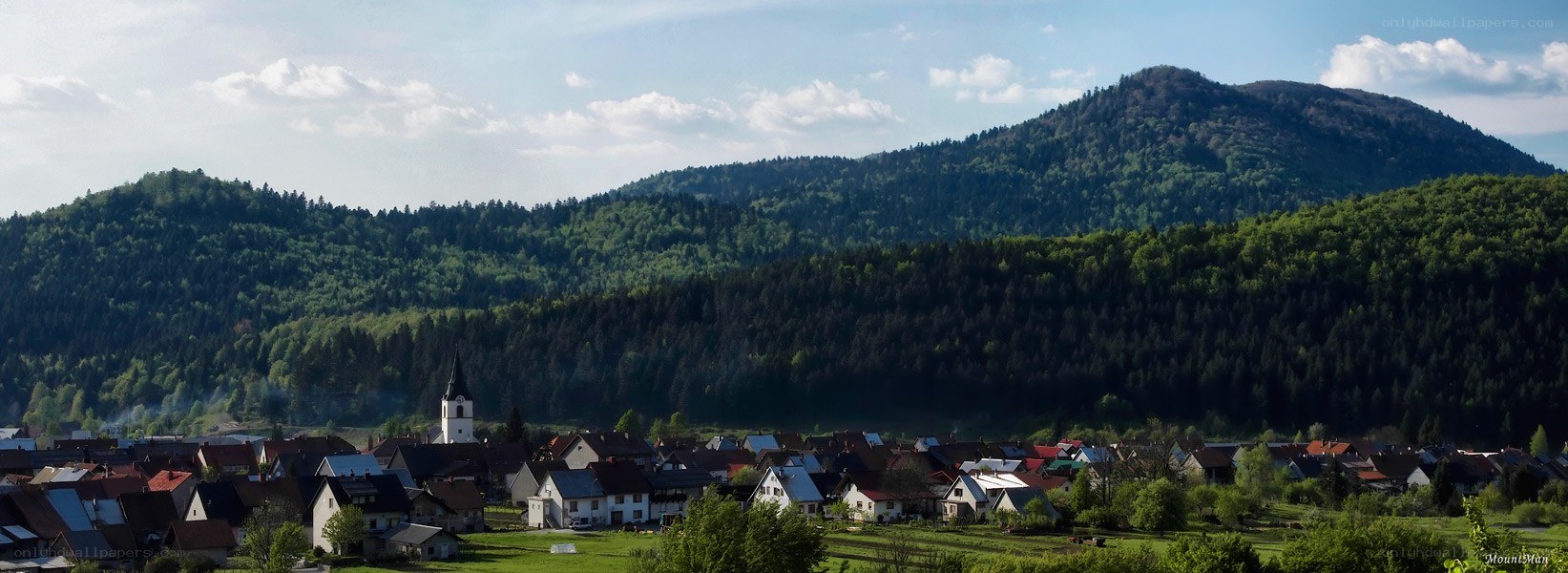 village in forested mountains