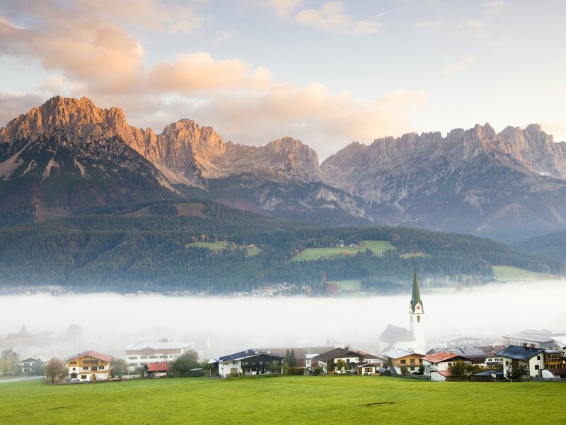 Village in mountain valley at dawn