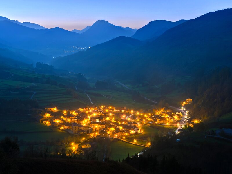 Village in Mountain Valley — Blue, Serene, Night, Photograph, Mountains