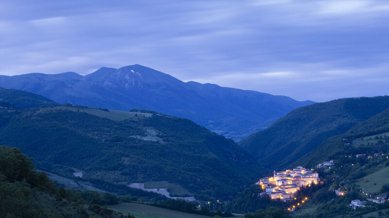 Village in Mountain Valley — Blue, Serene, Night, Photograph, Mountains, Town Lights