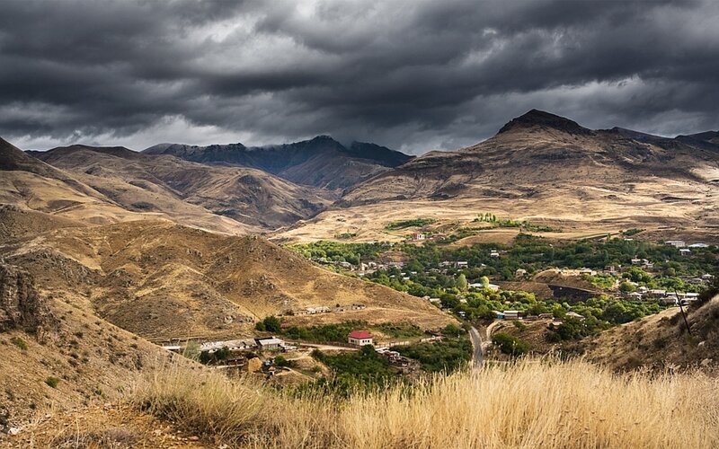 Village in Mountain Valley — Brown, Dramatic, Photograph
