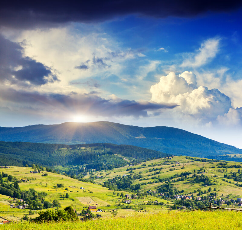 Village in Mountain Valley — Green, Dramatic, Afternoon, Photograph, Mountains, Clouds, Sunlight
