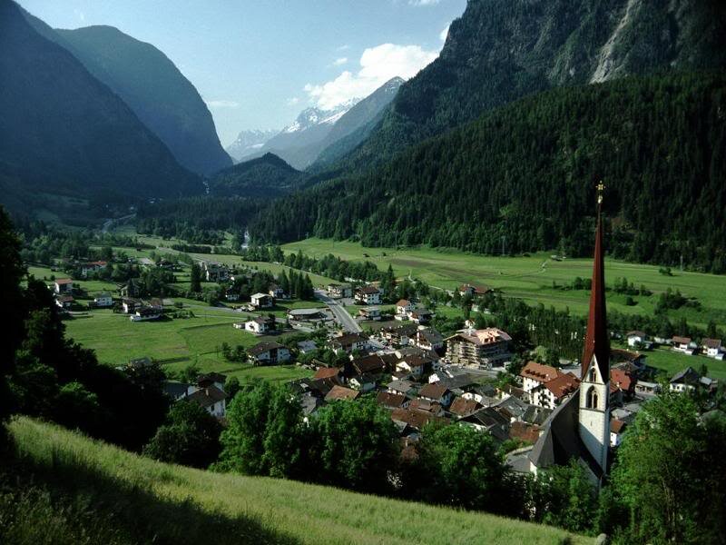 Village in Mountain Valley — Green, Serene, Afternoon, Photograph, Church Steeple, Mountains