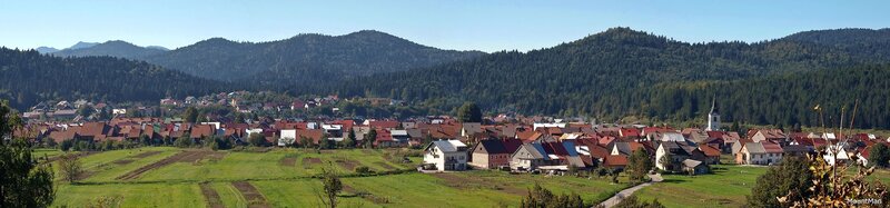 Village in Mountain Valley — Green, Serene, Afternoon, Photograph, Mountains, Church Steeple