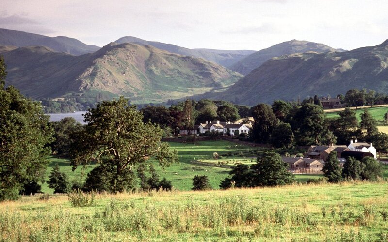 Village in Mountain Valley — Green, Serene, Afternoon, Photograph, Mountains, Lake, Buildings