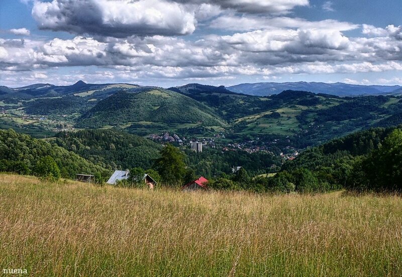Village in Mountain Valley — Green, Serene, Afternoon, Photograph, Mountains, Trees, Clouds