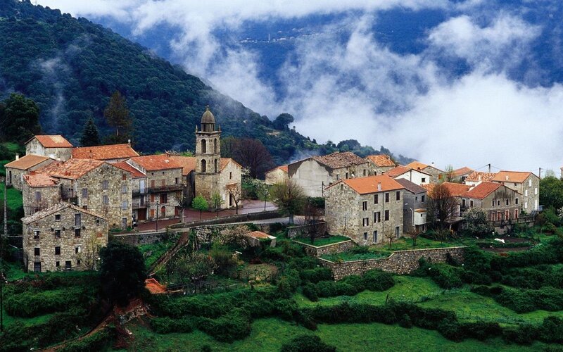 Village in Mountain Valley — Green, Serene, Morning, Photograph, Church, Clouds, Stone Houses