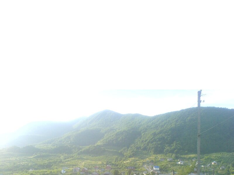 Village in Mountain Valley — Green, Serene, Morning, Photograph, Mountains, Houses, Telephone Pole