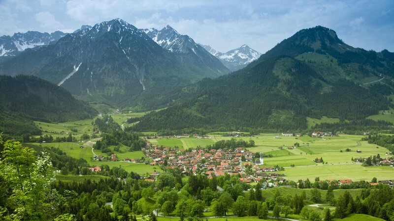 Village in Mountain Valley — Green, Serene, Summer, Photograph, Mountains, Fields