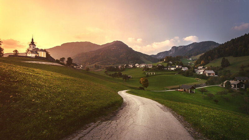 Village in Mountain Valley — Green, Serene, Sunset, Photograph, Church