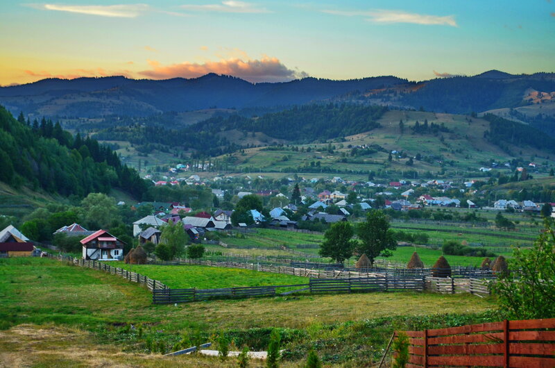 Village in Mountain Valley — Green, Serene, Sunset, Photograph
