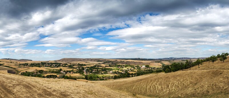 Village in Rolling Hills — Brown, Dramatic