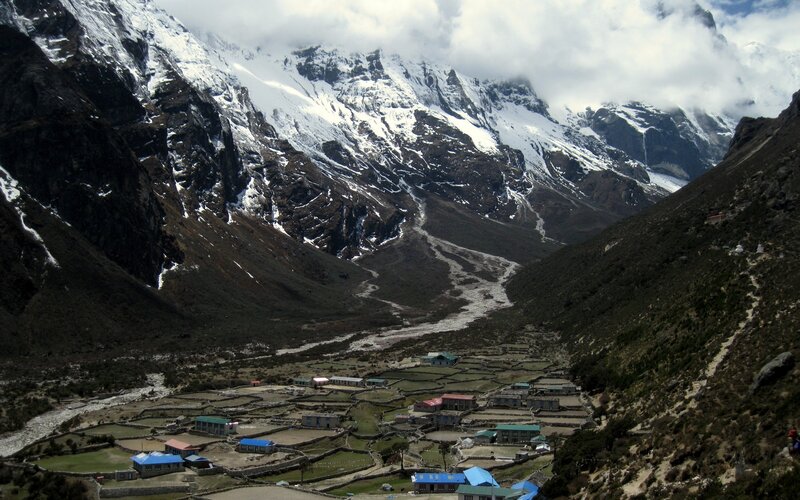village in snowy mountain valley