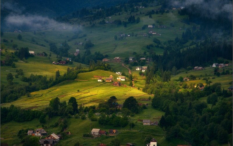 Village in the misty hills