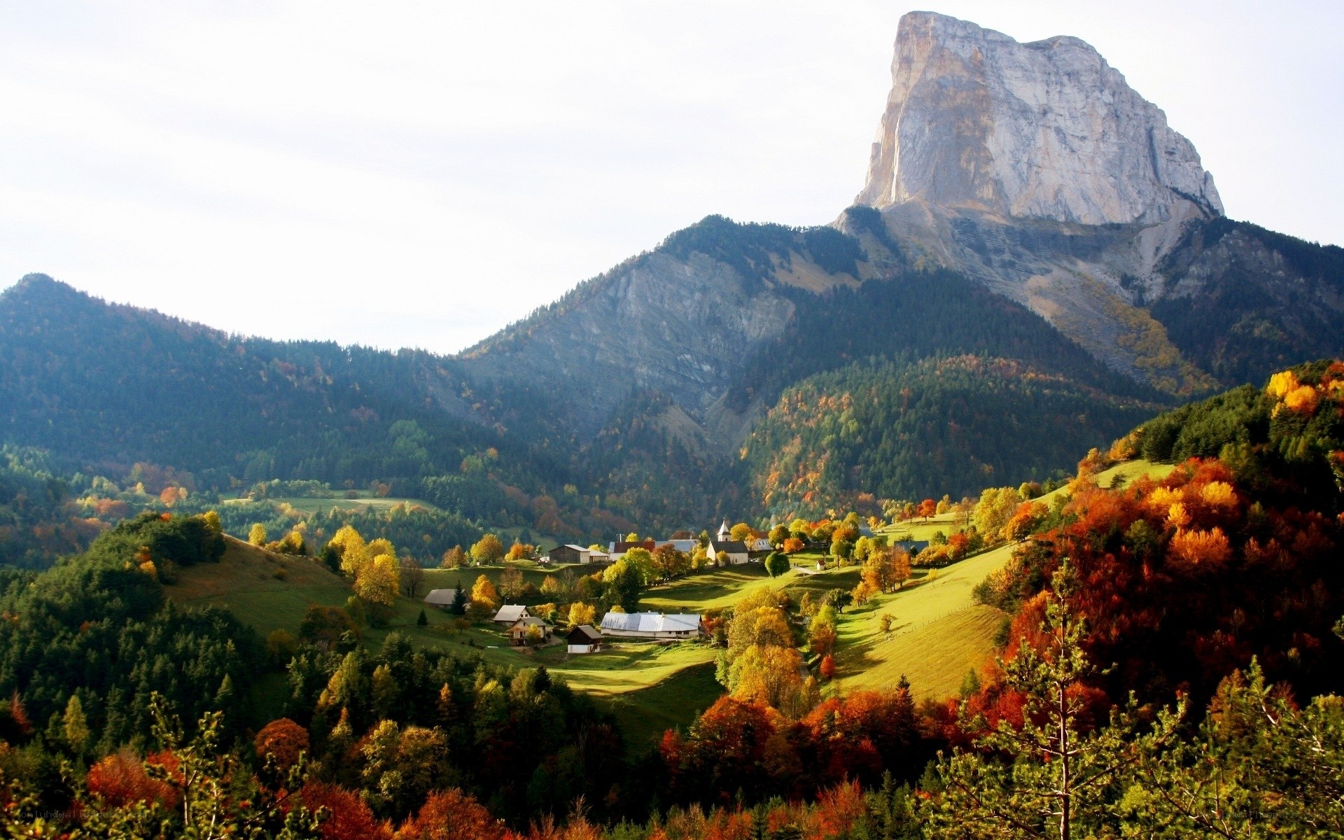 Village nestled in autumn mountains