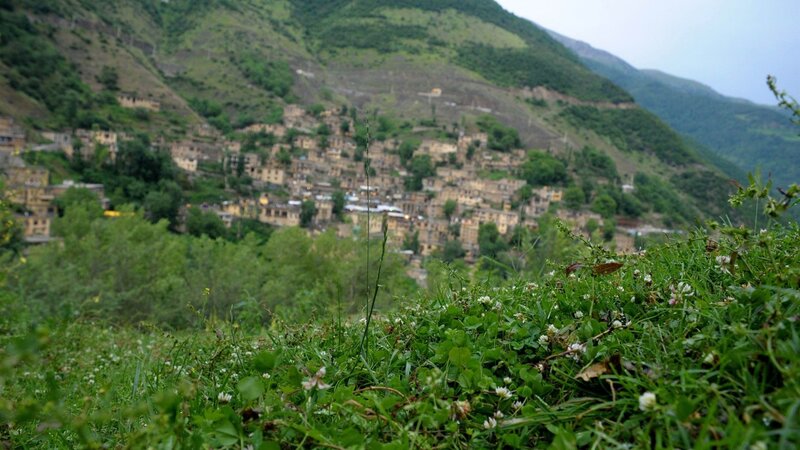 village nestled in green hills