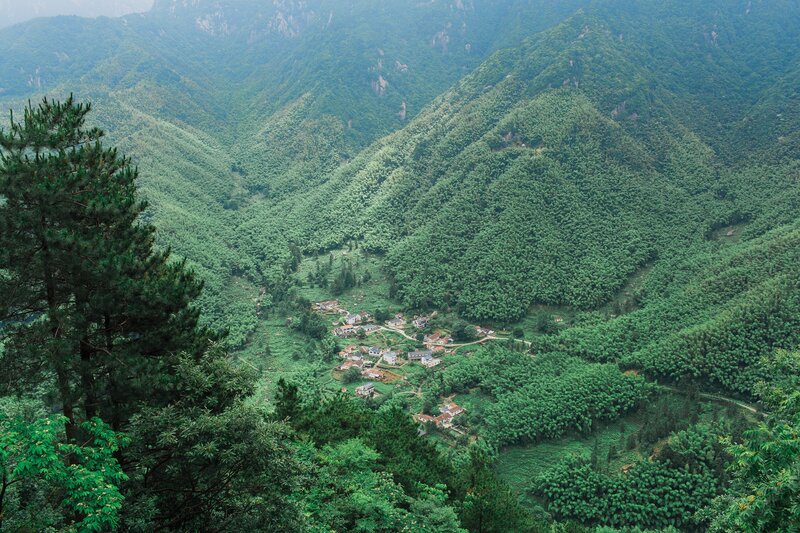 village nestled in green mountains