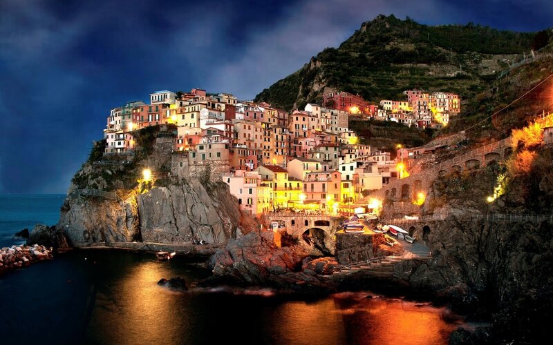 Village on a cliff at night