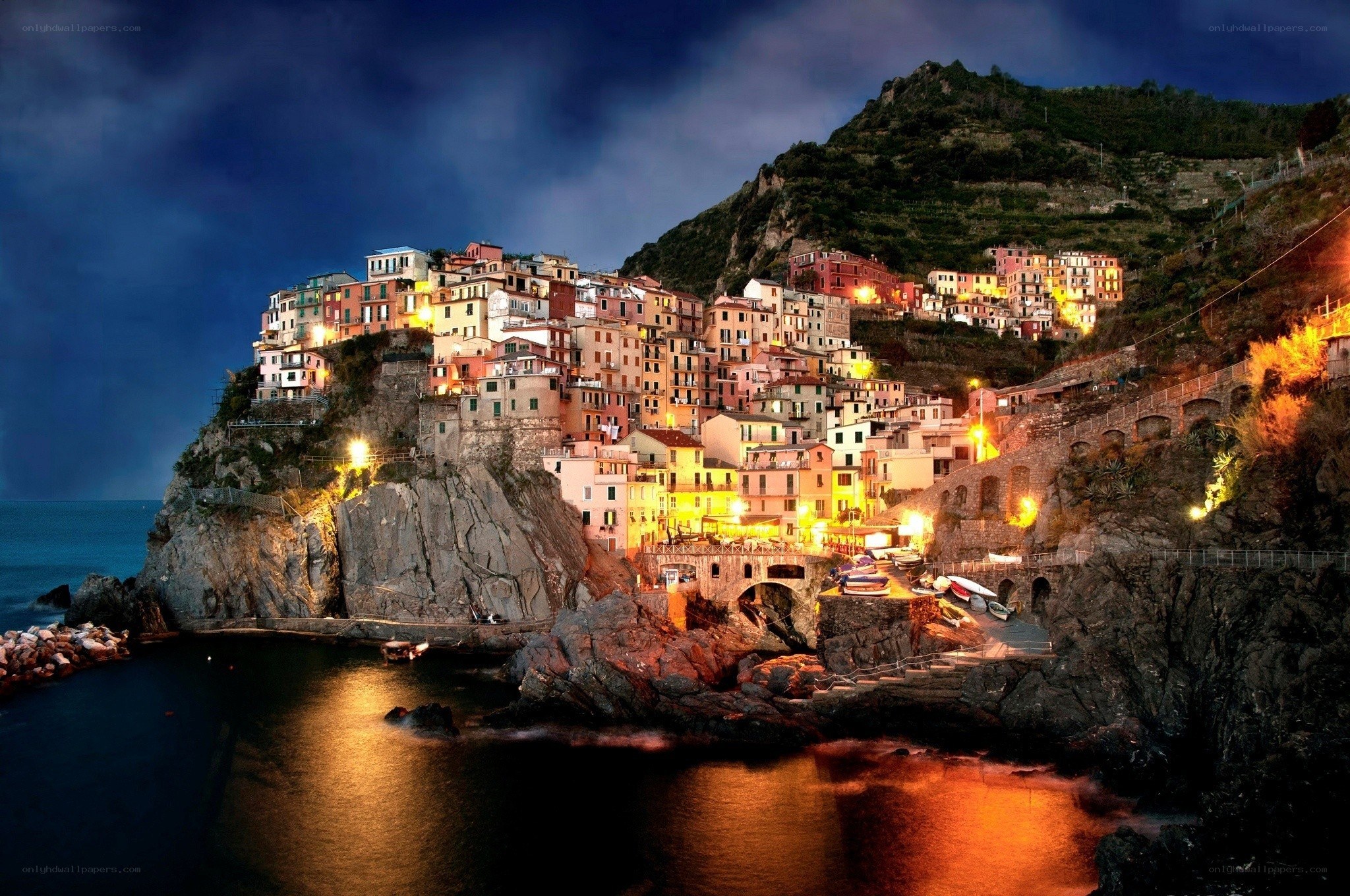 Village on a cliff at night