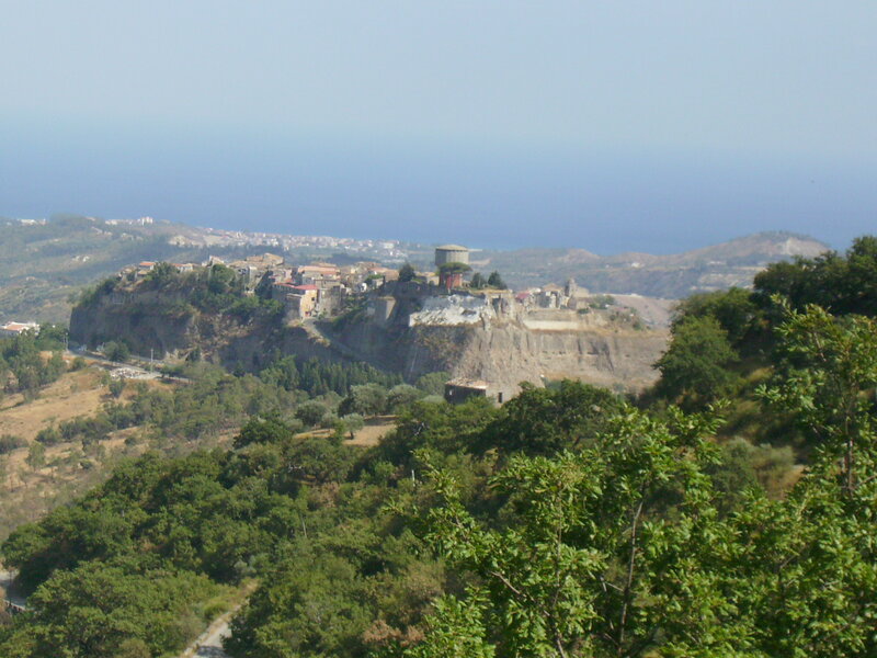 village on a cliff overlooking the sea