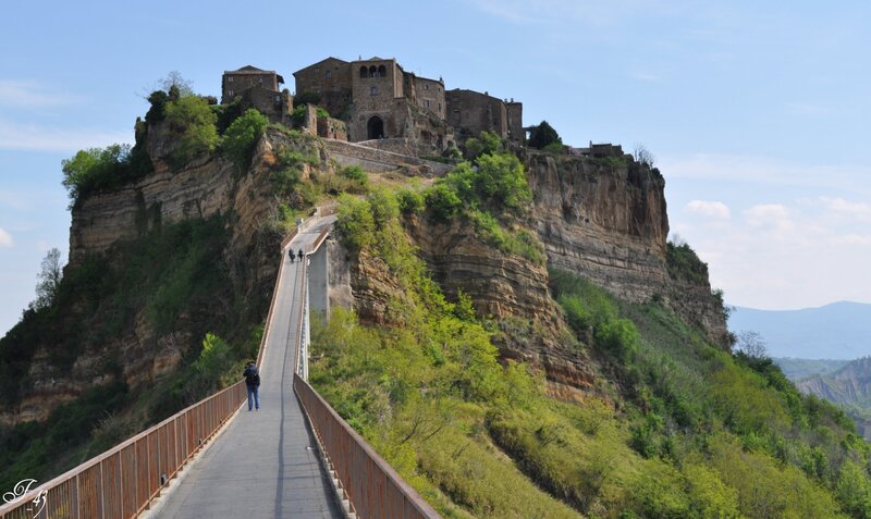 Village on a cliff with suspension bridge