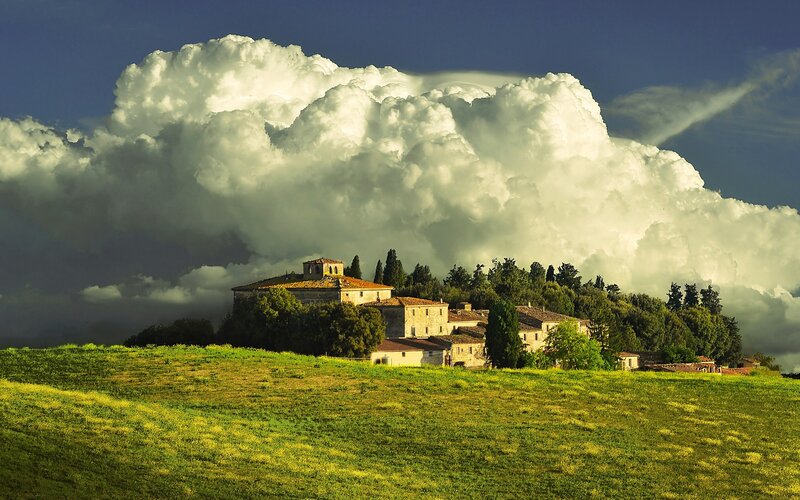 Village on a Hill — Green, Dramatic, Afternoon, Photograph, Clouds, Trees, Buildings