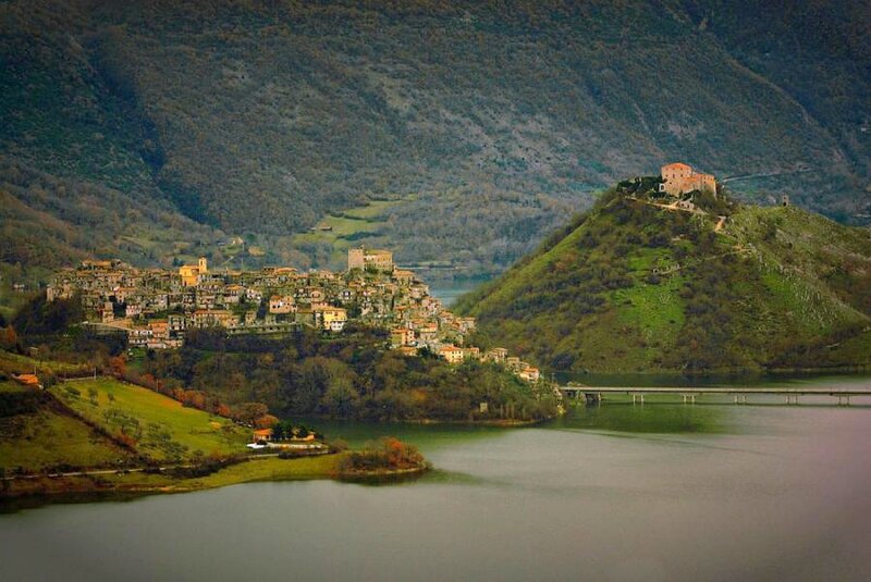 village on a hillside by the lake