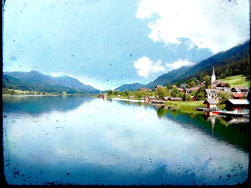 village on a lake in the mountains
