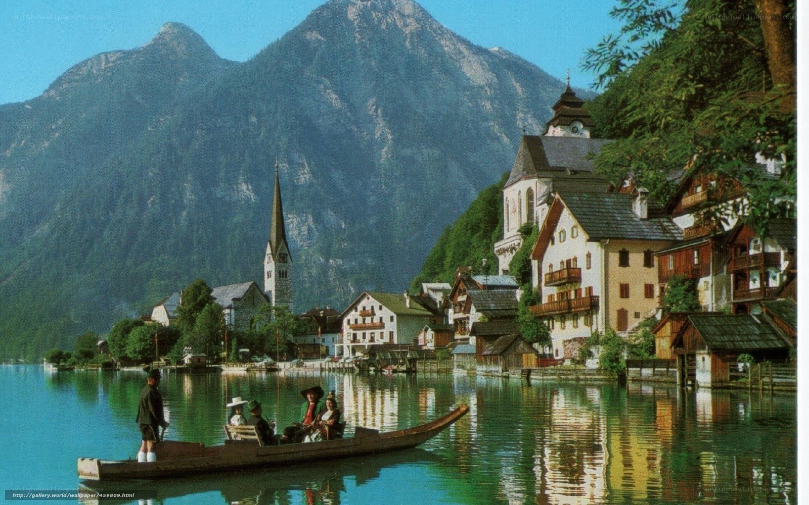 village on a lake with mountains