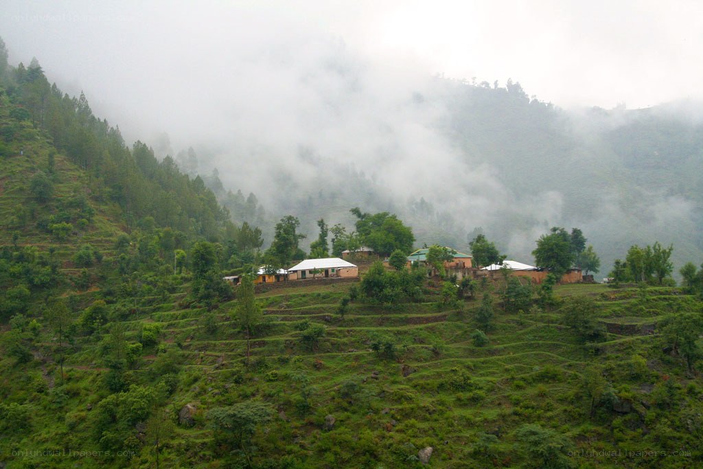 Village on a misty hillside