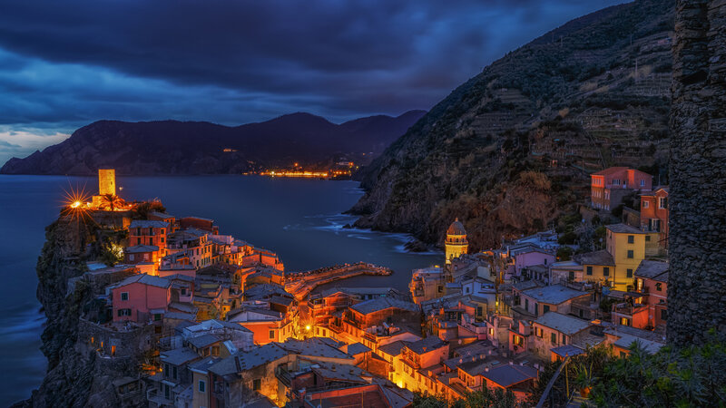 Village on Coastal Cliff — Blue, Dramatic, Night, Photograph, Sea, Mountain