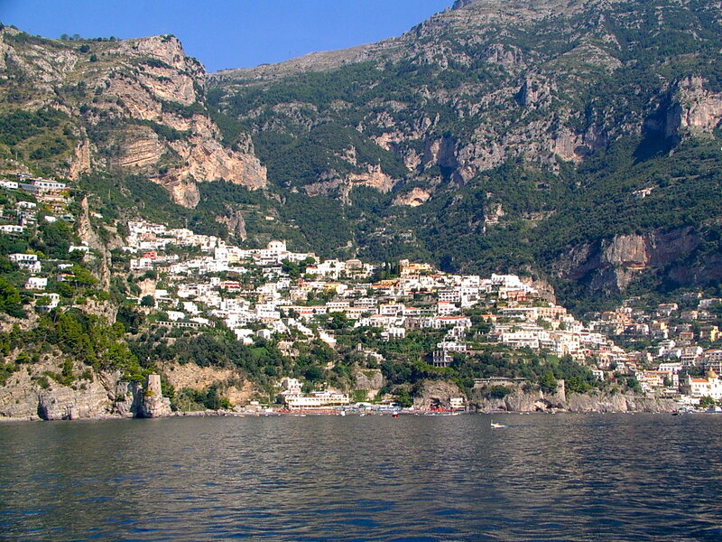 Village on Coastal Cliff — Blue, Serene, Afternoon, Photograph, Mountain, Sea