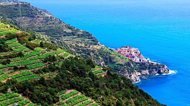 Village on Coastal Cliff — Blue, Serene, Afternoon, Photograph, Ocean