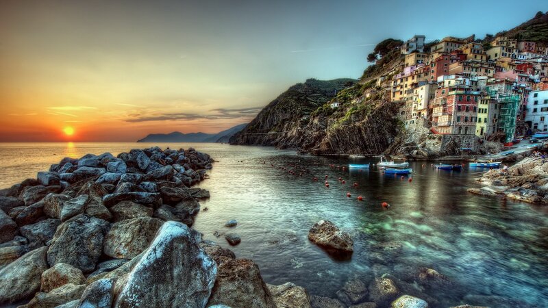 Village on Coastal Cliff — Blue, Serene, Sunset, Photograph, Sea