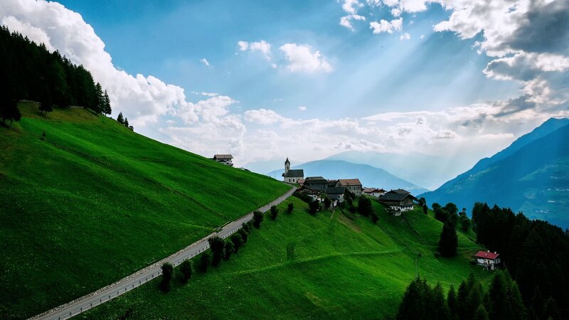 Village on Green Hillside — Serene