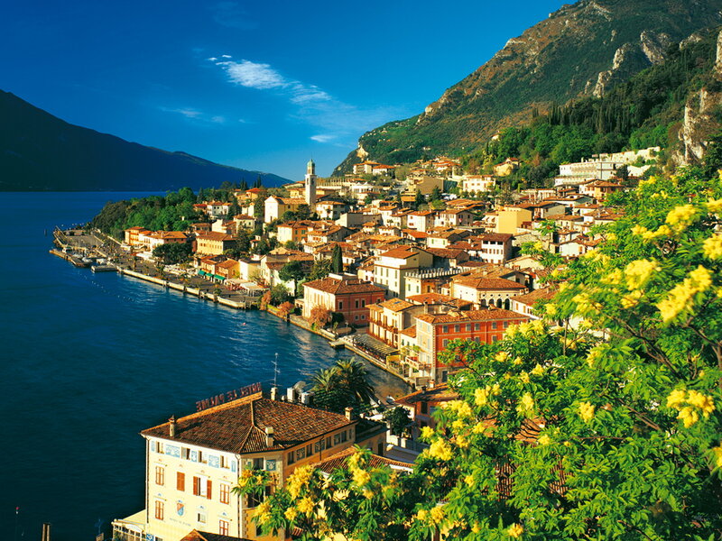 Village on Lake Shore — Blue, Serene, Afternoon, Photograph, Mountain, Buildings