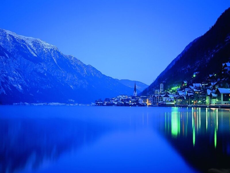 Village on Lake Shore — Blue, Serene, Night, Photograph, Mountains, Buildings, Church