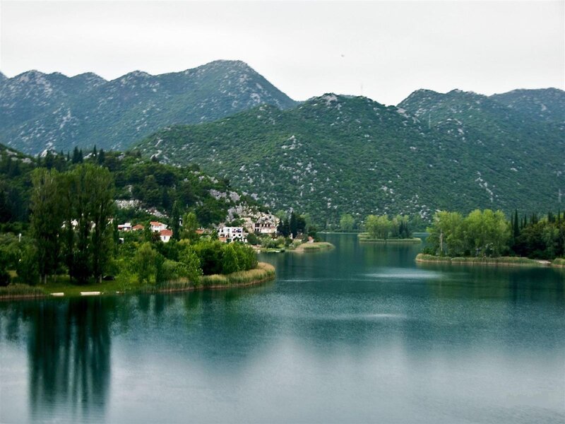 Village on Lake Shore — Green, Serene, Morning, Photograph, Mountains, Trees