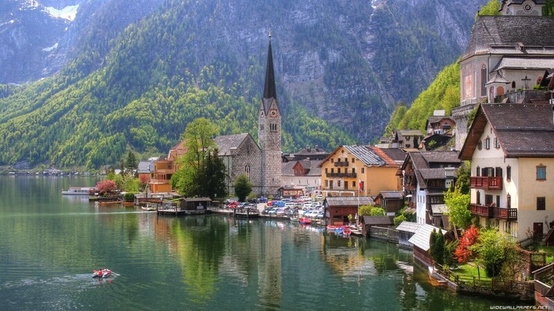 Village on Lake Shore — Green, Serene, Summer, Photograph, Church, Mountains, Boats