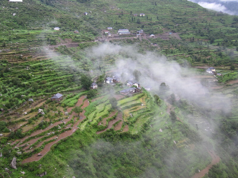 Village on misty terraced hills